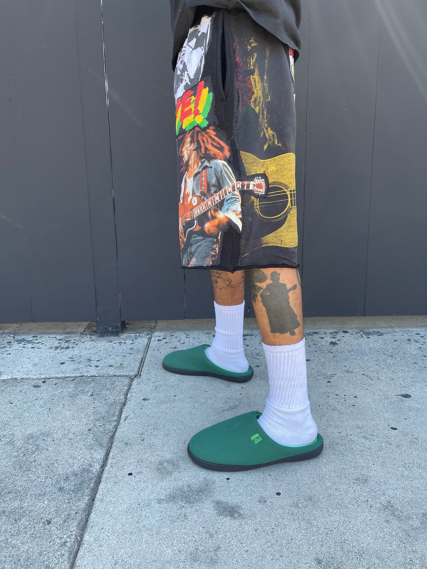 Bluesin’s “Richness Is Life Forever” Bob Marley Patchwork Sweat Shorts