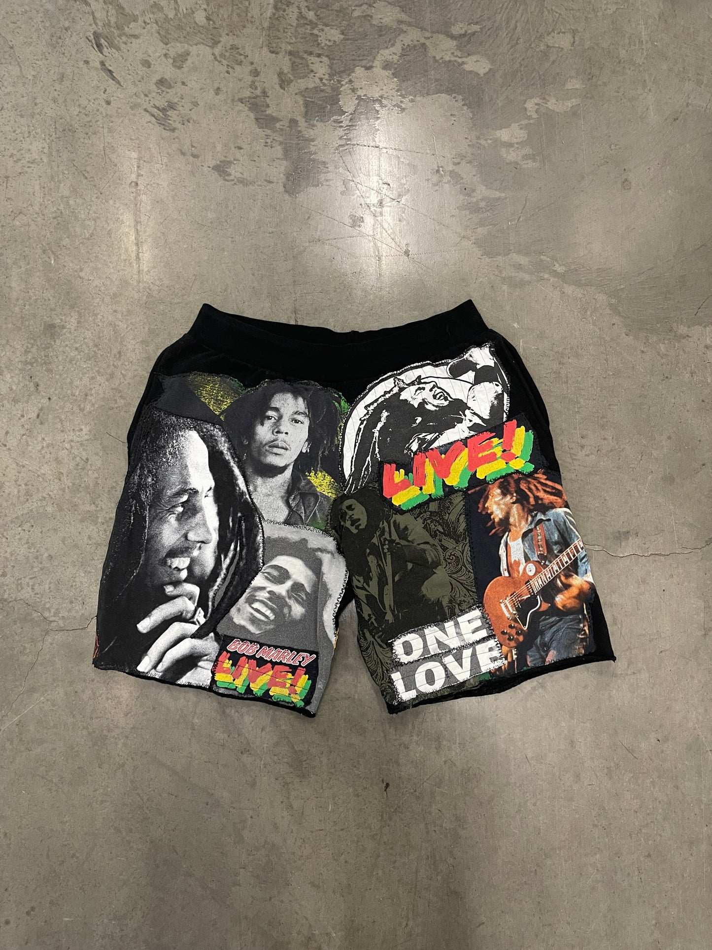 Bluesin’s “Richness Is Life Forever” Bob Marley Patchwork Sweat Shorts
