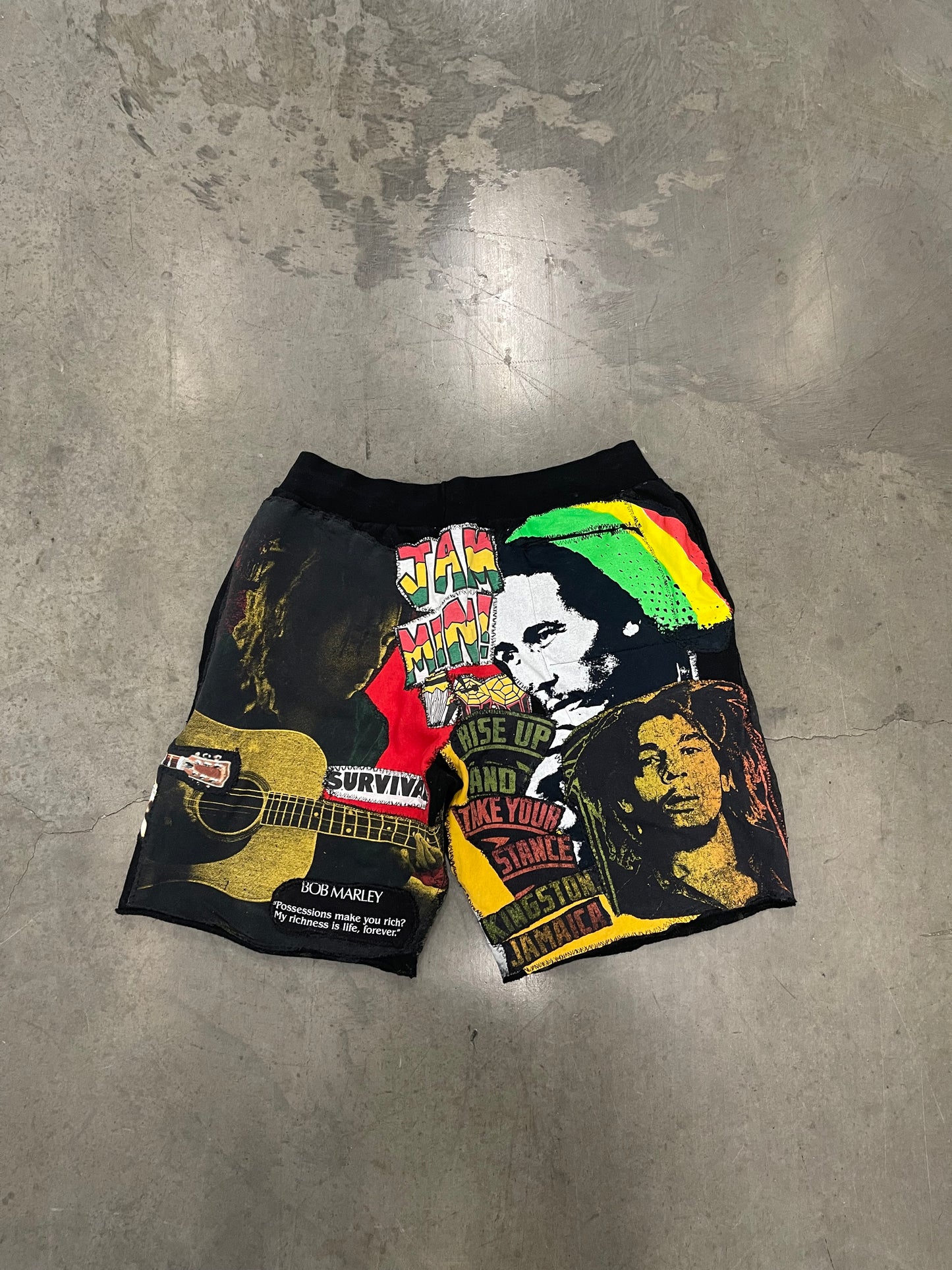Bluesin’s “Richness Is Life Forever” Bob Marley Patchwork Sweat Shorts
