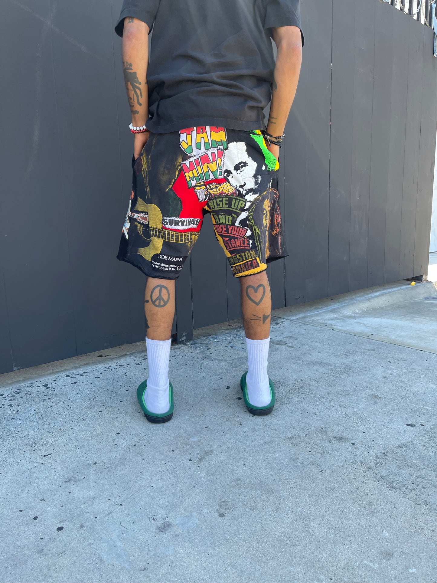 Bluesin’s “Richness Is Life Forever” Bob Marley Patchwork Sweat Shorts