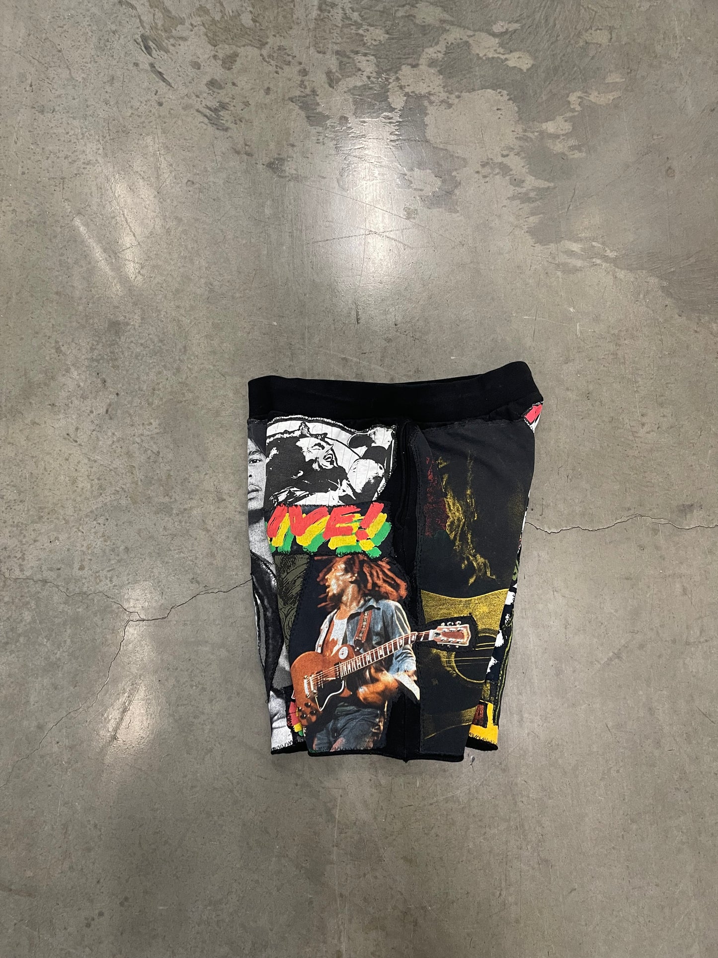 Bluesin’s “Richness Is Life Forever” Bob Marley Patchwork Sweat Shorts