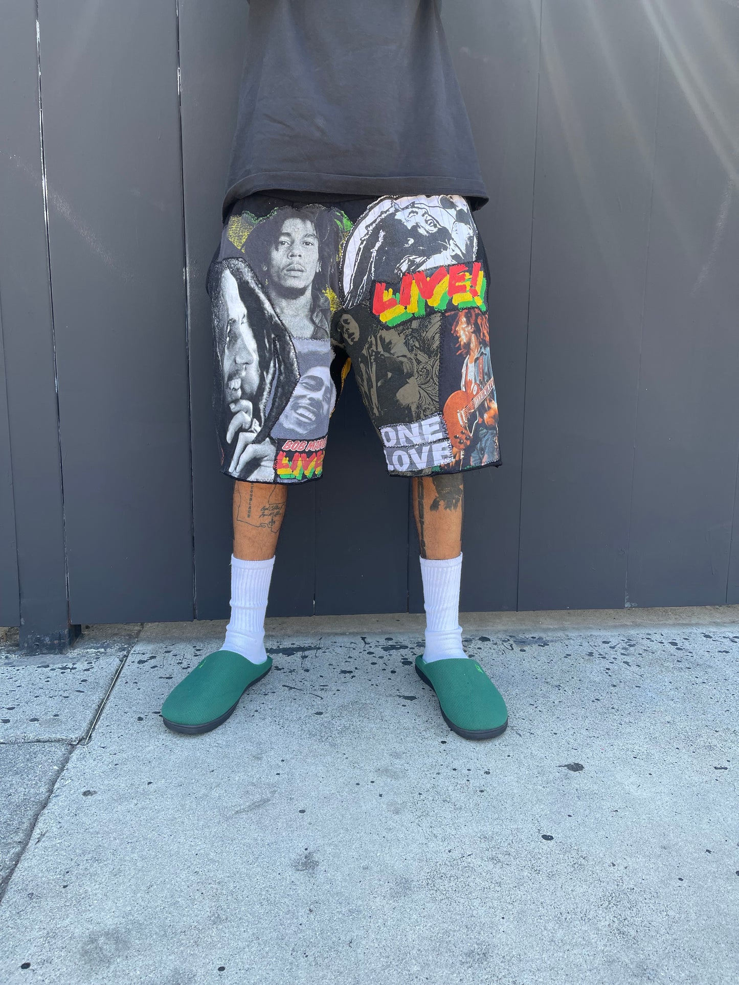 Bluesin’s “Richness Is Life Forever” Bob Marley Patchwork Sweat Shorts