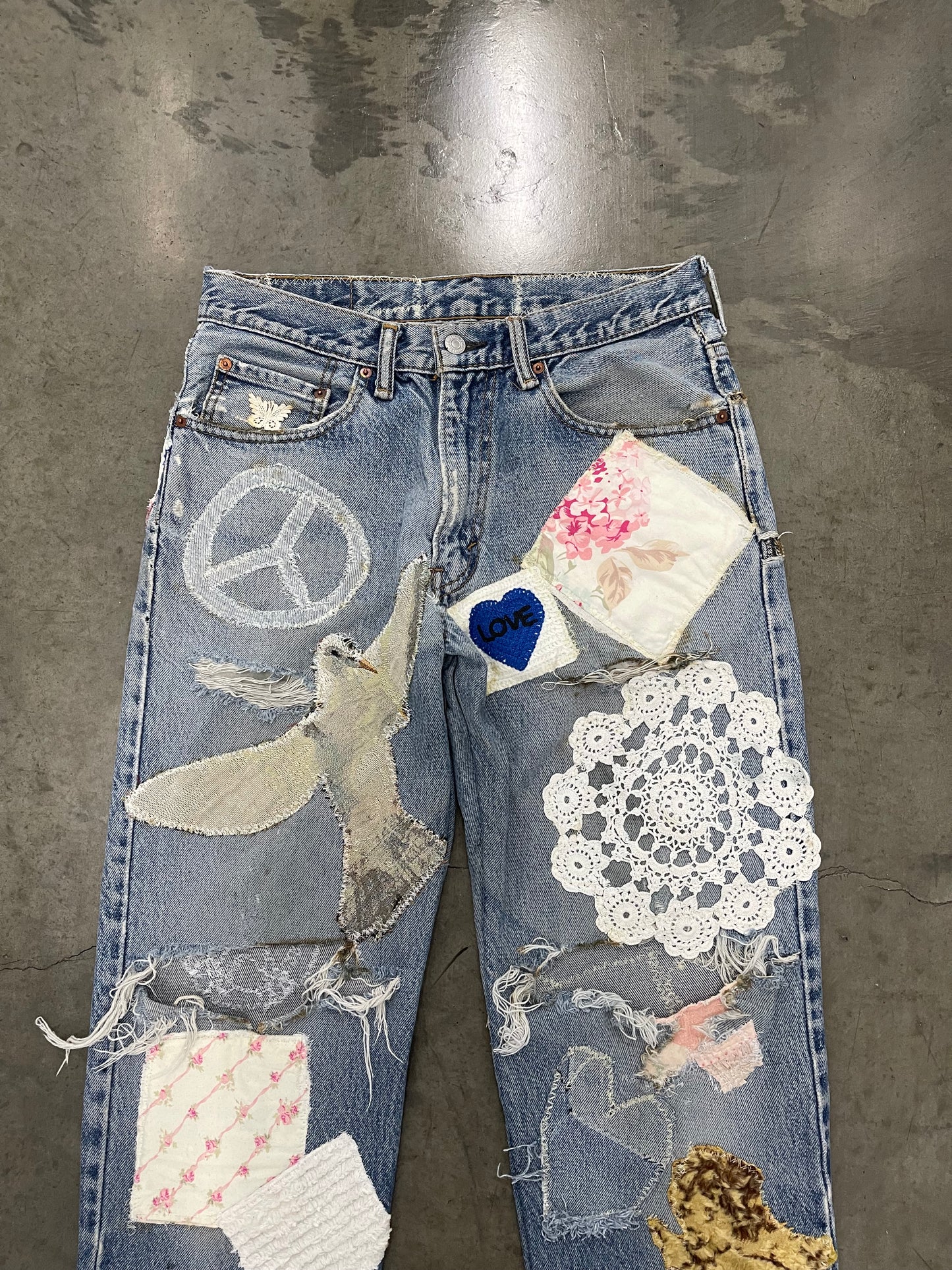 Bluesin’s “Peace Love & Healing” Patchwork Reworked Denim Jeans