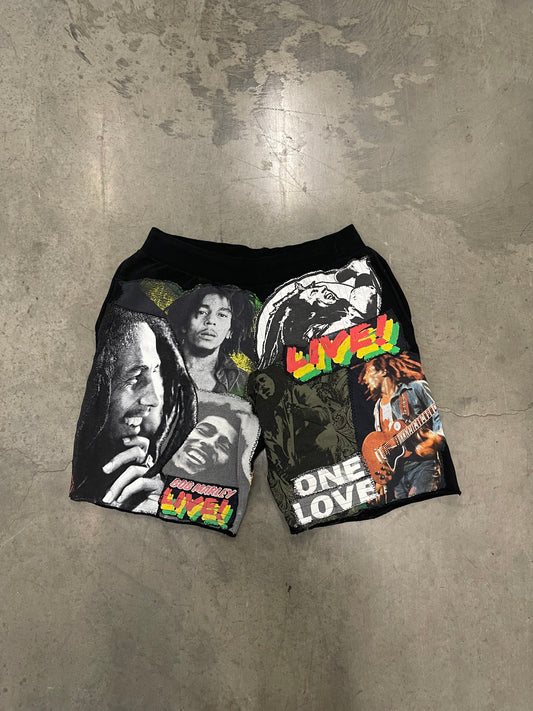 Bluesin’s “Richness Is Life Forever” Bob Marley Patchwork Sweat Shorts