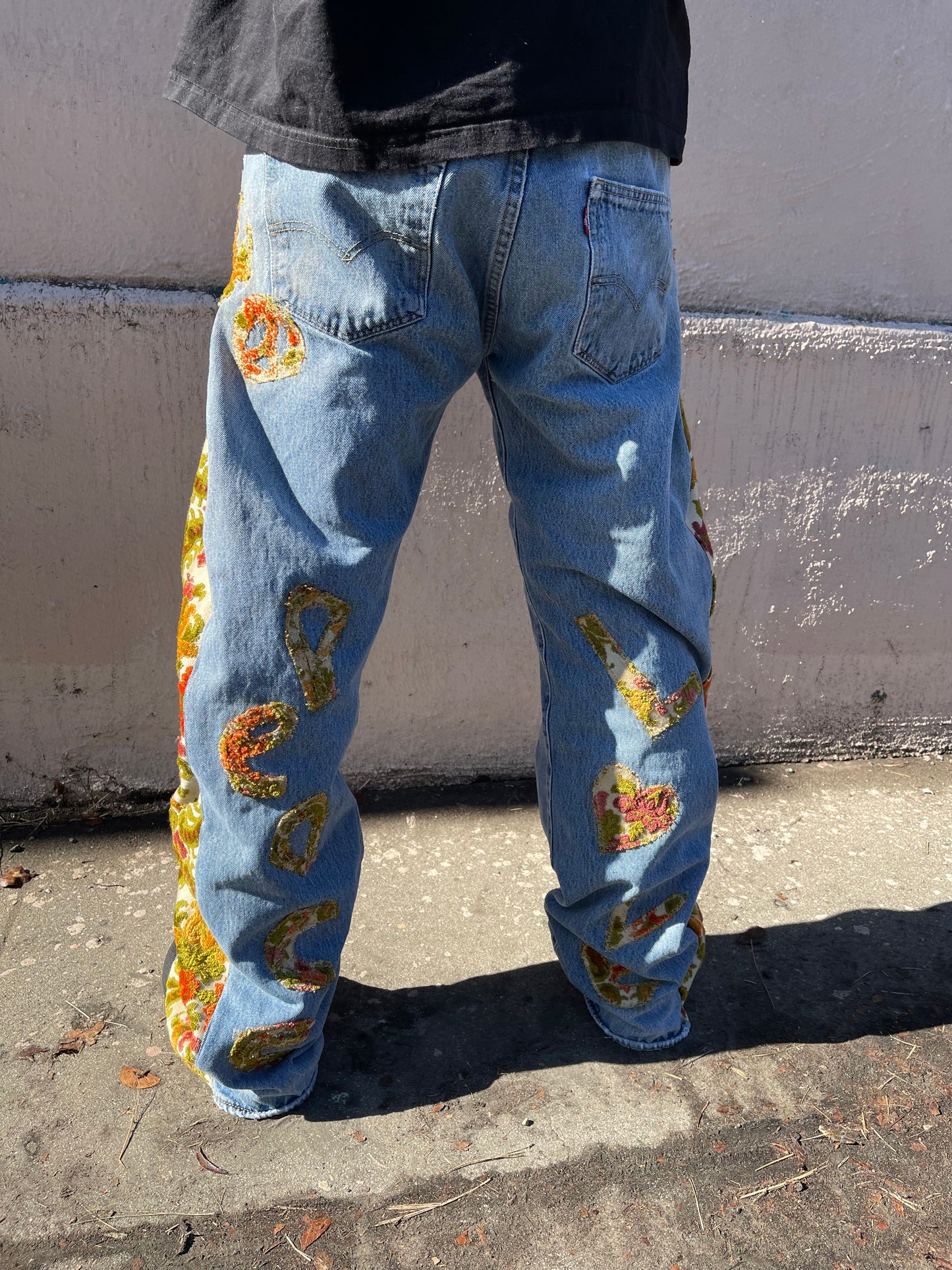 Bluesin’s “Seeds For Peace” Flared Floral Patchwork Denim Jeans