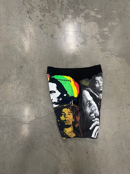 Bluesin’s “Richness Is Life Forever” Bob Marley Patchwork Sweat Shorts