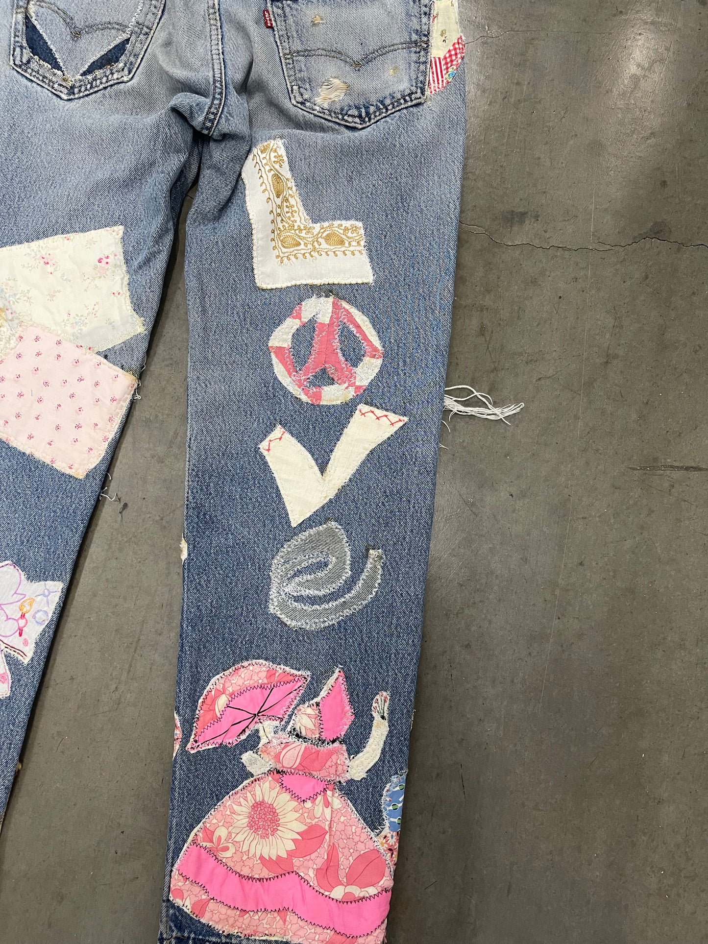 Bluesin’s “Peace Love & Healing” Patchwork Reworked Denim Jeans