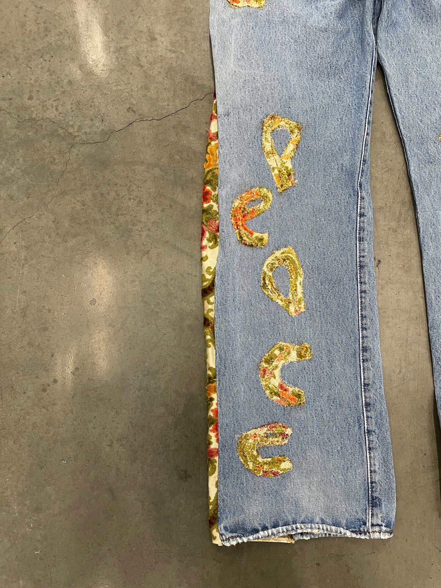 Bluesin’s “Seeds For Peace” Flared Floral Patchwork Denim Jeans