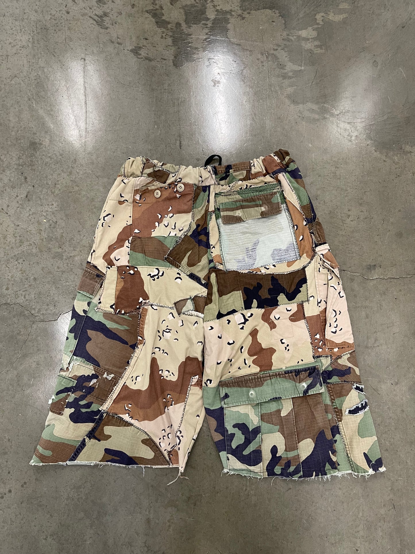 BLUESIN’S “BLENDED SURROUNDINGS” PATCHWORK CAMOUFLAGE CARGO SHORTS