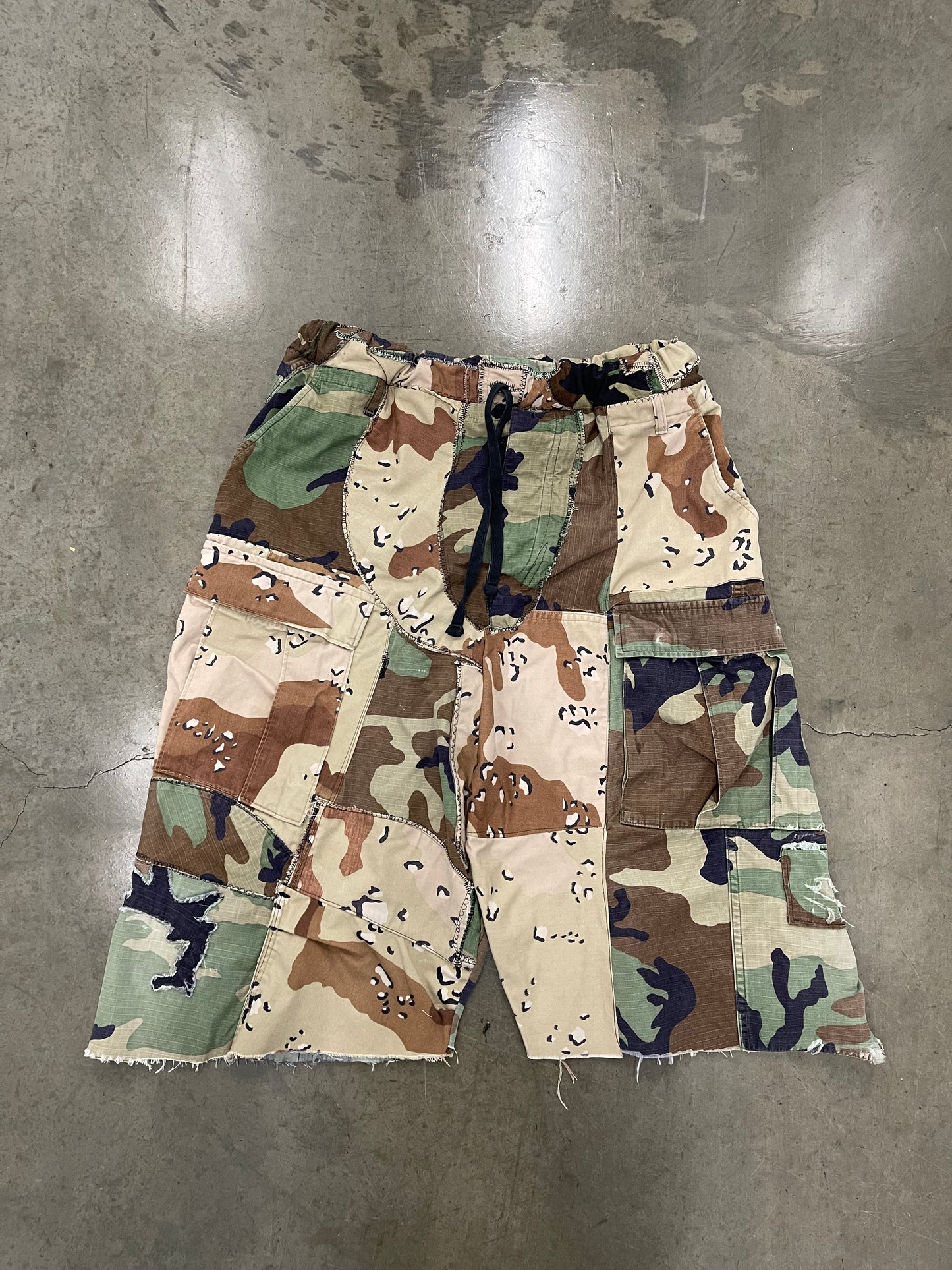 BLUESIN’S “BLENDED SURROUNDINGS” PATCHWORK CAMOUFLAGE CARGO SHORTS